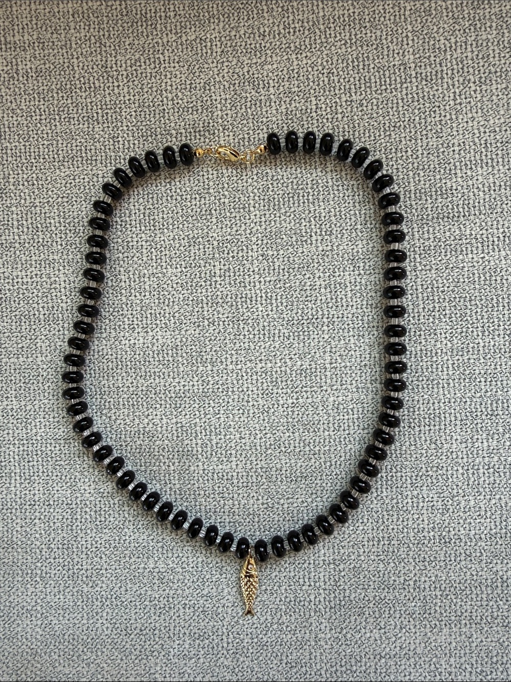 Black Beaded Necklace with Gold Fish Charm